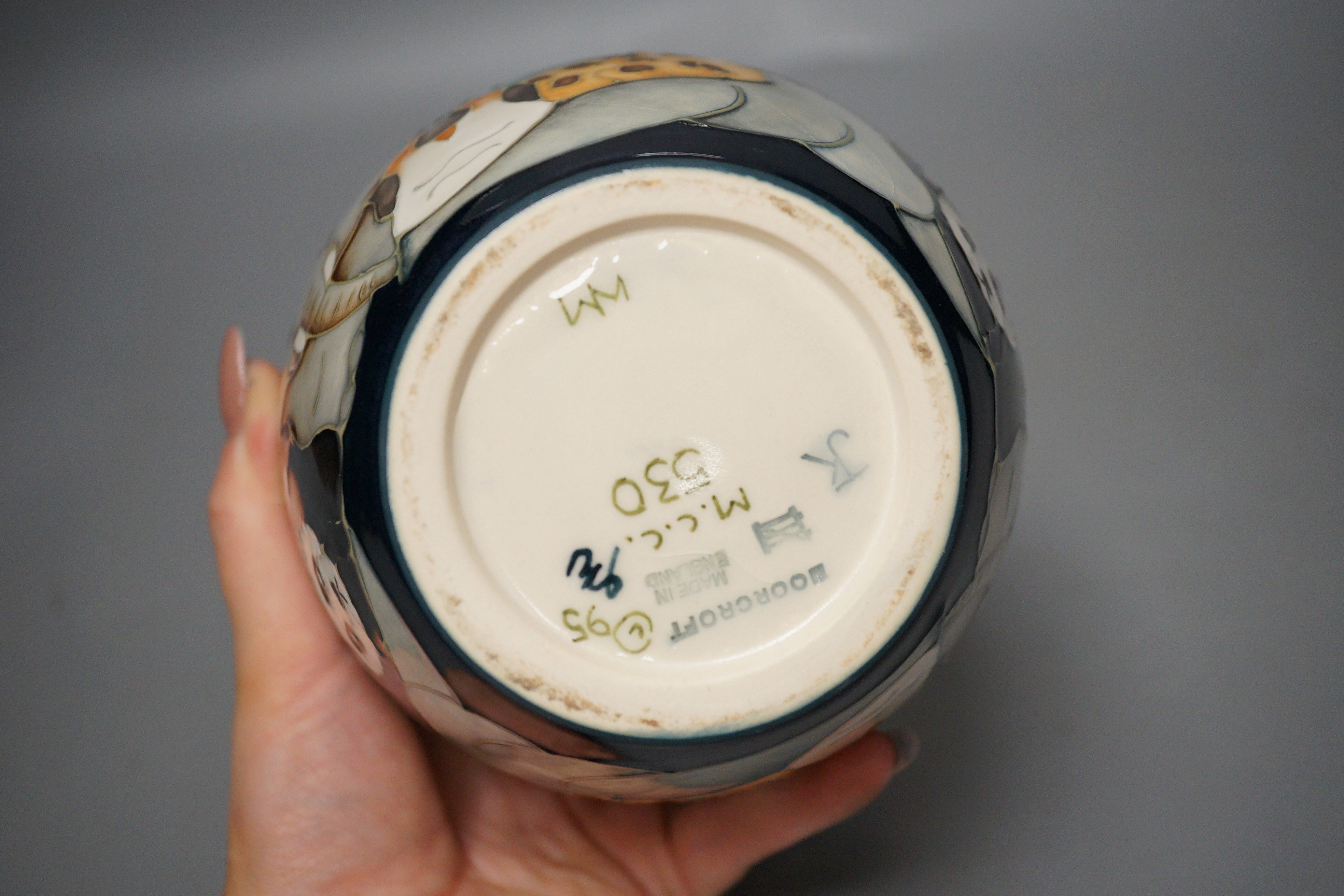 A Moorcroft pottery Noah’s Ark lidded ginger jar, base monogrammed JK and marked ‘M.C.C 530’, 15cm